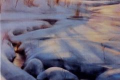 A snow covered stream and field landscape at dawn.