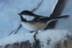 A painting of Chickadee on a snowy branch